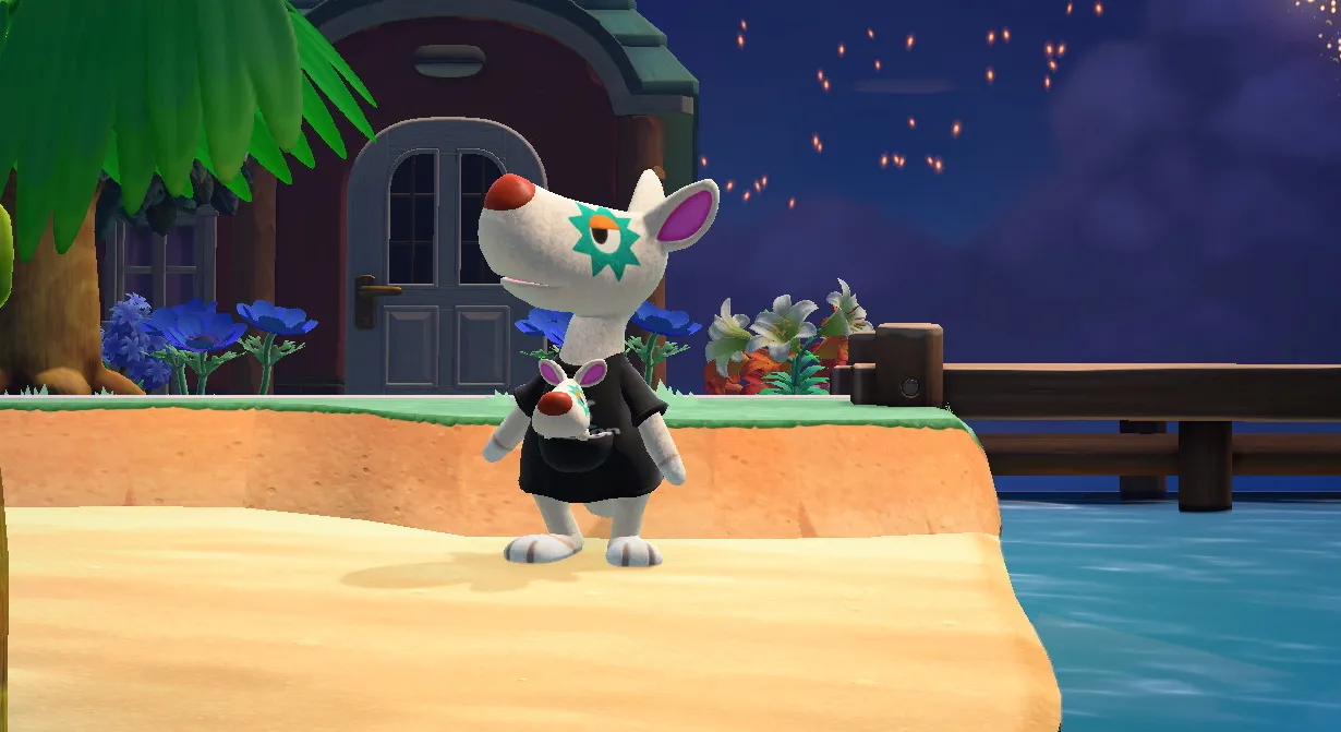 Astrid disfrutando del espectáculo de fuegos artificiales afuera de su casa en Animal Crossing: New Horizons.
